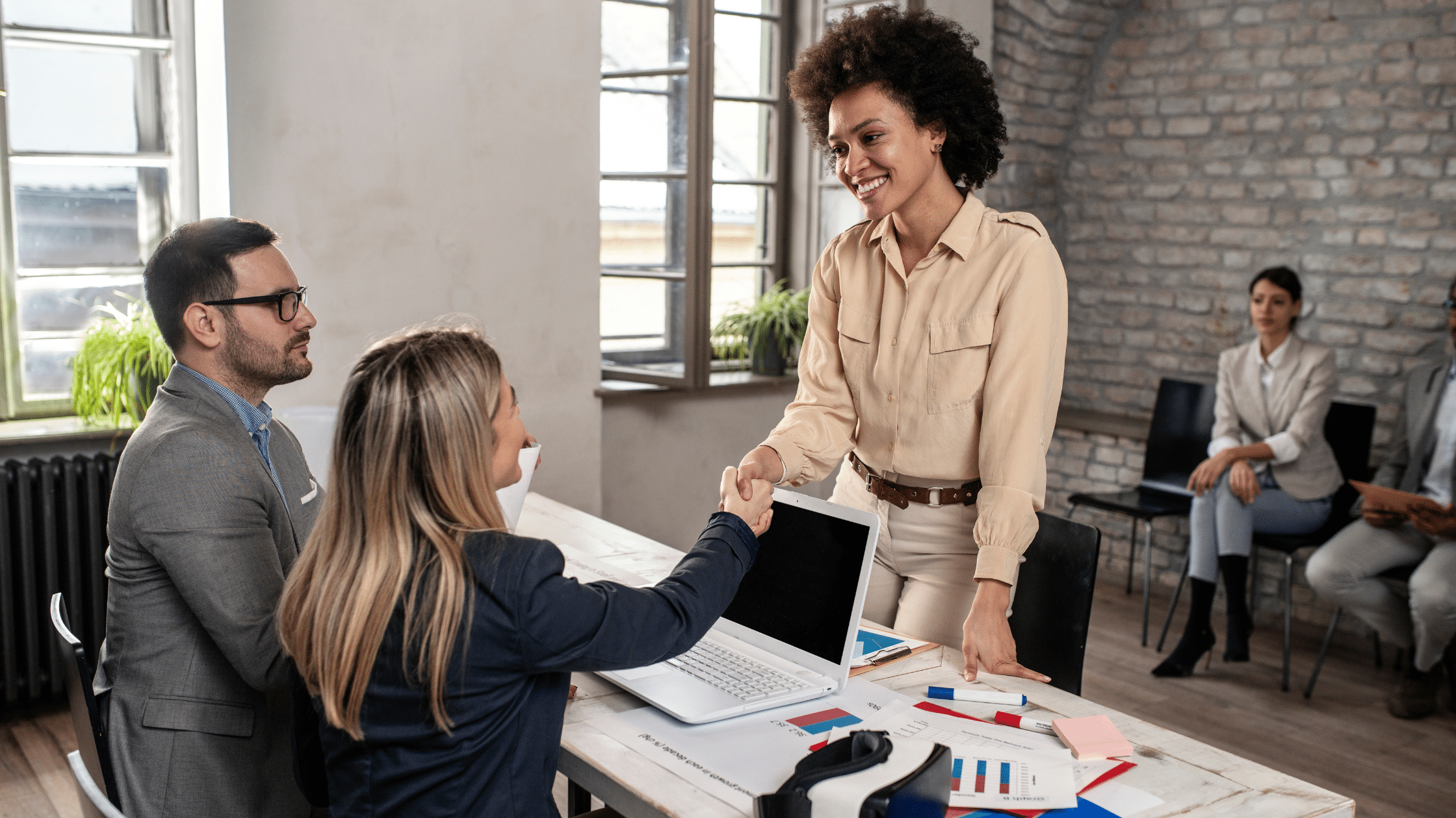 Woman shaking hands with hiring manager