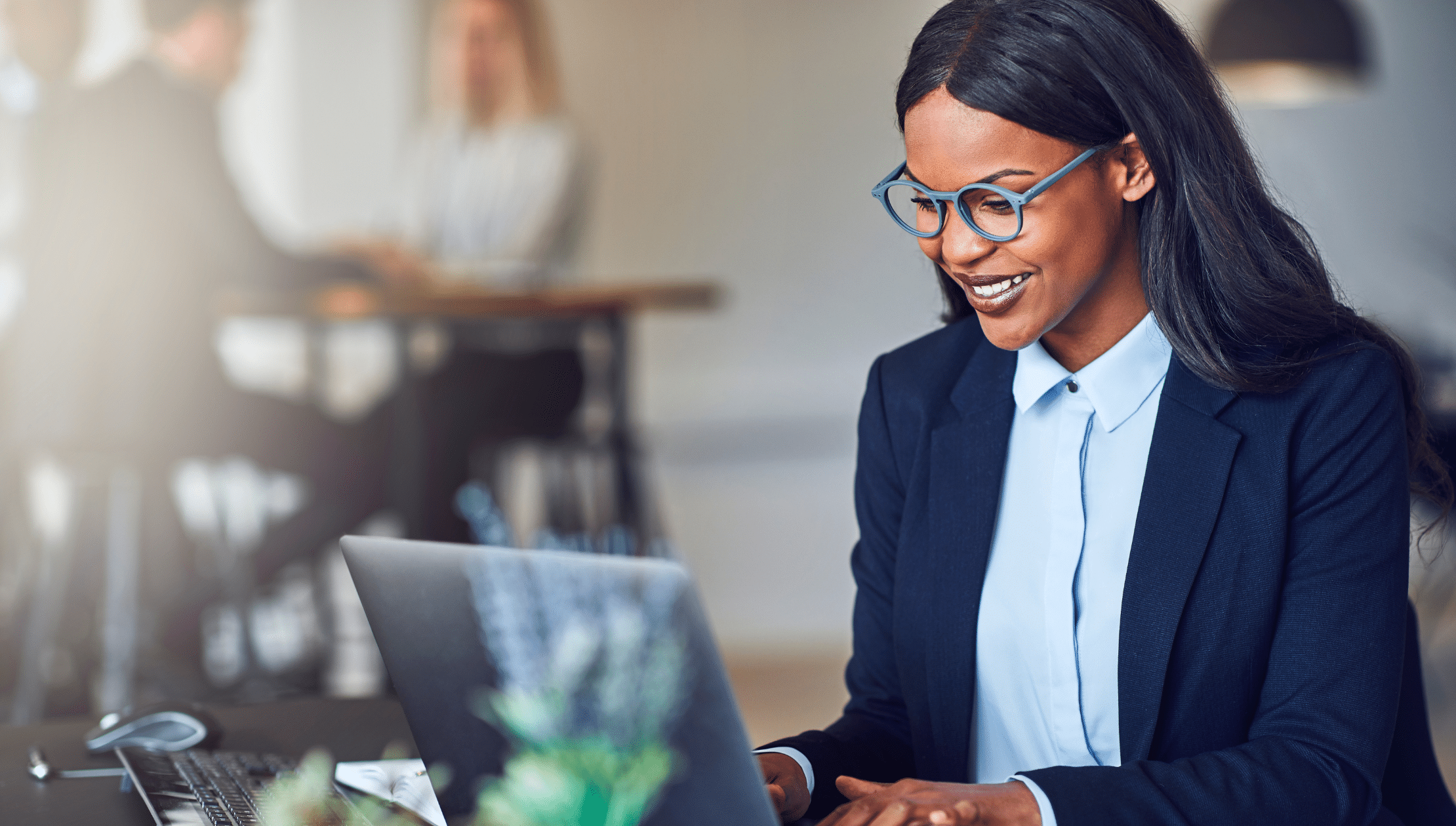 Woman at working looking at computer