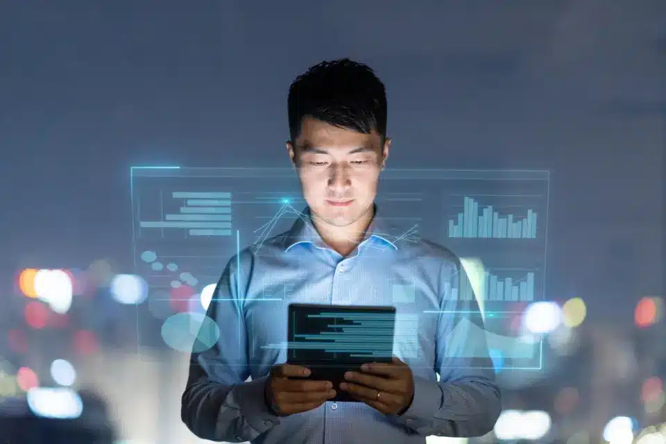 Man looking at tablet screen using technology